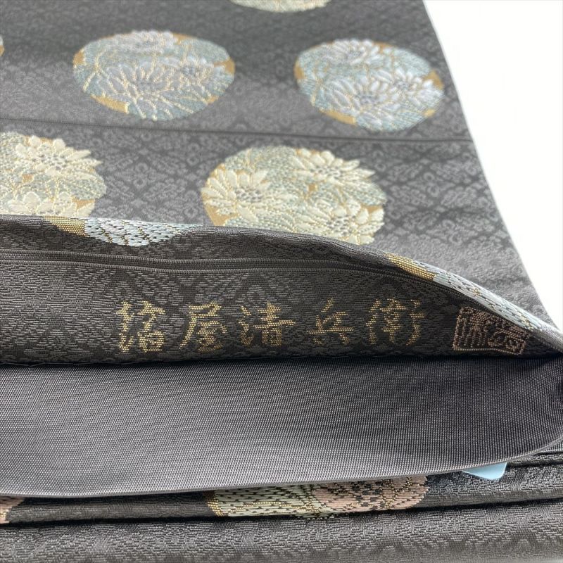 中古）袋帯 グレージュ セミフォーマル 六通 草木染 織り 引き箔 丸に花 絹